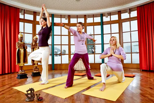 Women on a yoga mat during a yoga session