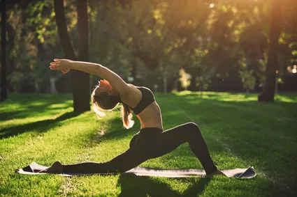 A woman trying out yoga styles